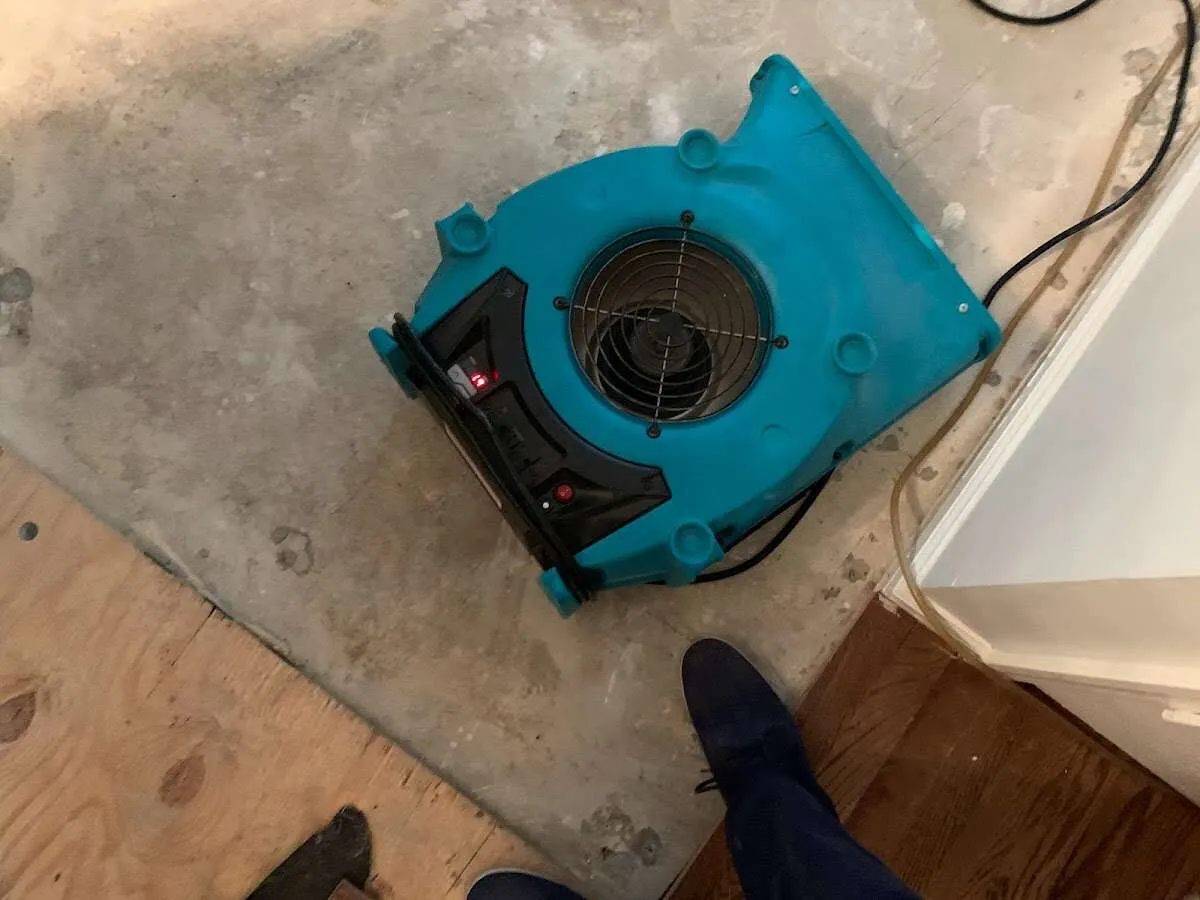 Air mover drying subfloor during Commercial Water Damage Restoration in Acworth